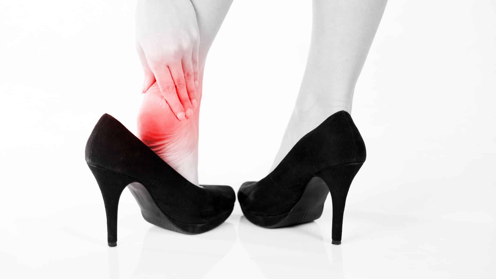 Female pain in heel wearing high heels